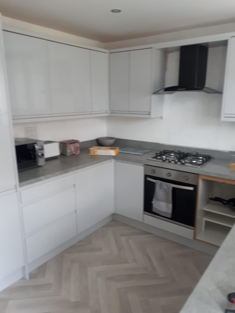 Existing kitchen cabinets refurbished using Handleless J Pull style doors installed by CL Joinery